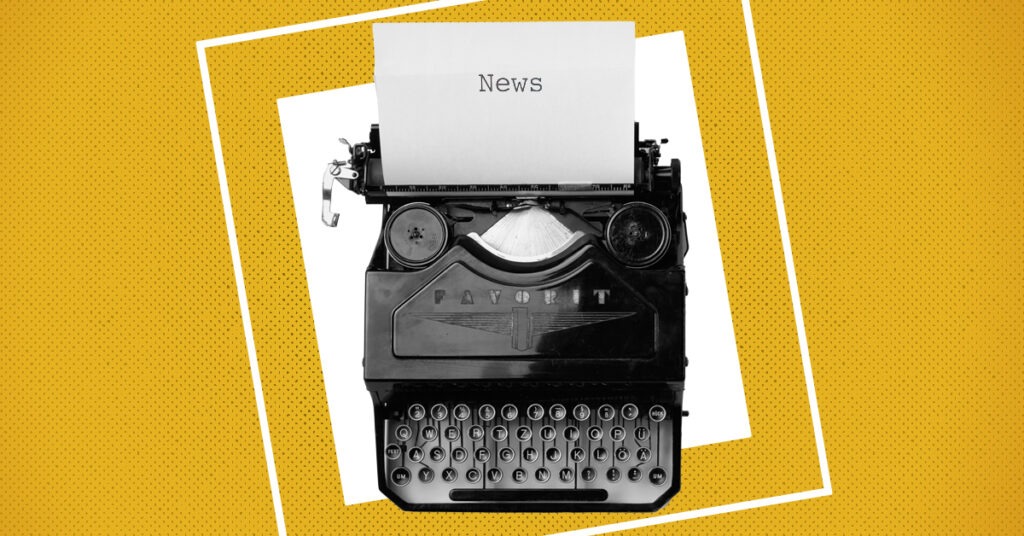 A typewriter with a note on it and a yellow background.