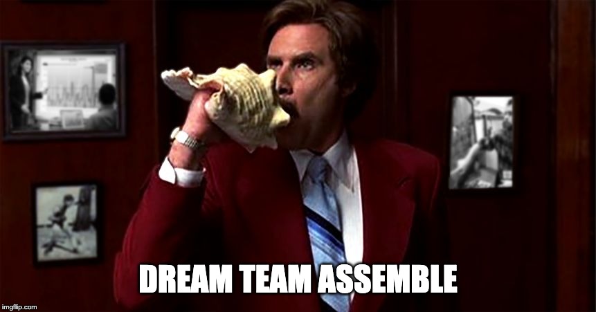 Man in a red suit blowing into a conch shell with a caption that reads "dream team assemble".