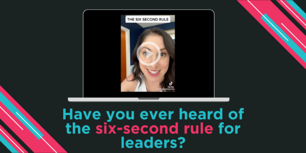 Laptop screen displaying a video titled "the six second rule" with a woman looking through a magnifying glass, overlaying text asking, "have you ever heard of the six-second rule for leaders?.