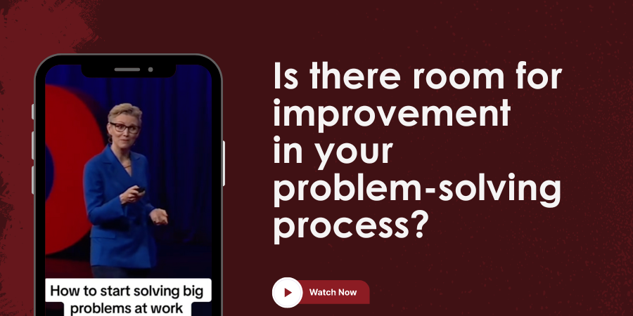 Person in blue suit speaking on stage, displayed on a phone screen. Text on background: "Is there room for improvement in your problem-solving process?" Button below: "Watch Now".