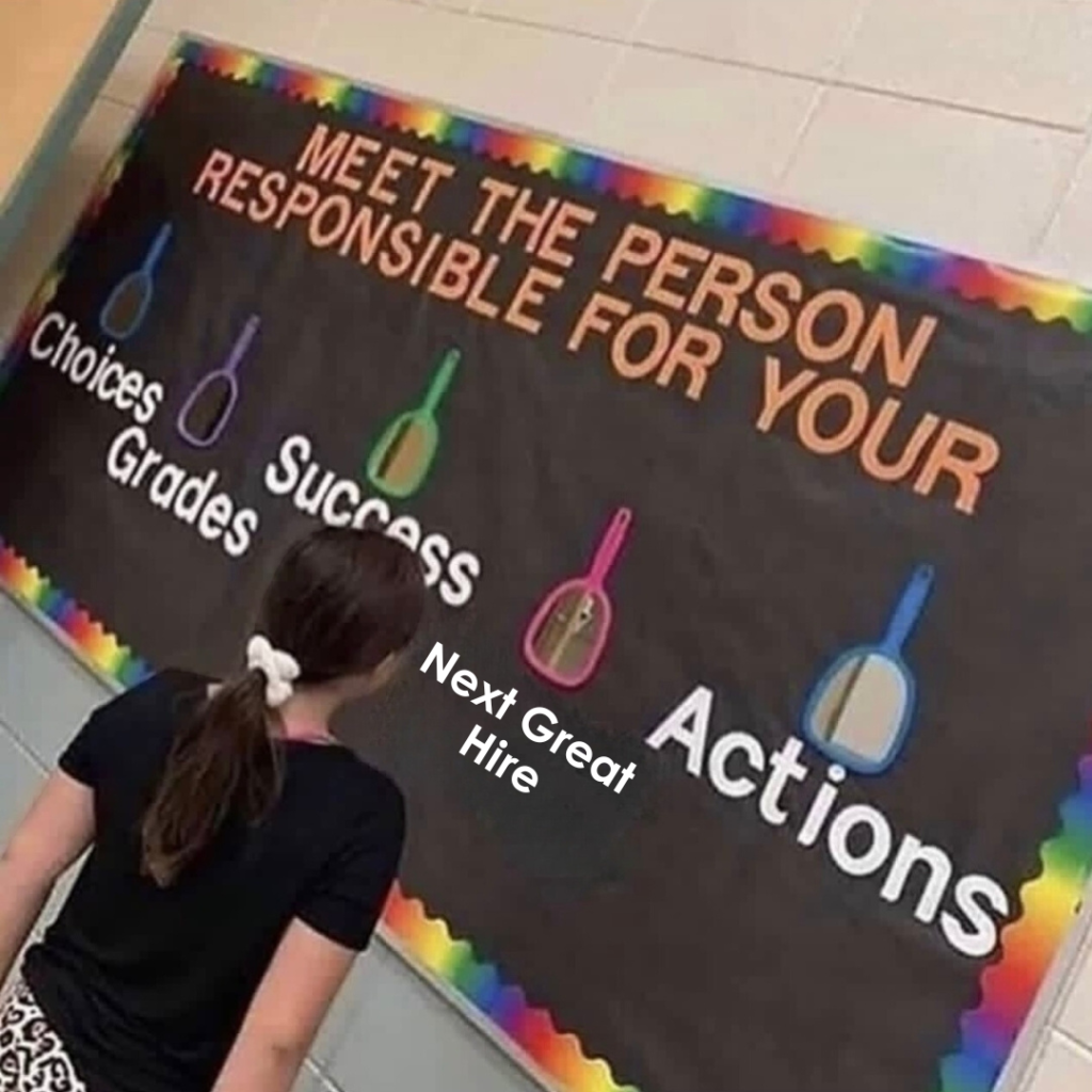 A person stands in front of a bulletin board that reads "Meet the person responsible for your choices, grades, success, actions." Each word is labeled on a mirror, and "Next Great Hire" is on one mirror.