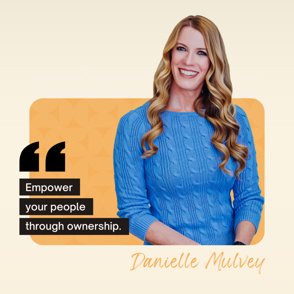 A woman with long blonde hair and a blue sweater smiles. The text reads, "Empower your people through ownership." The name "Danielle Mulvey" is inscribed at the bottom right.